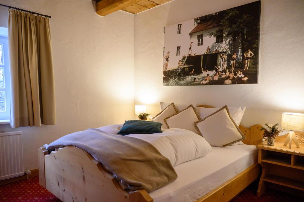 Postel nebo postele na pokoji v ubytování InselMühle