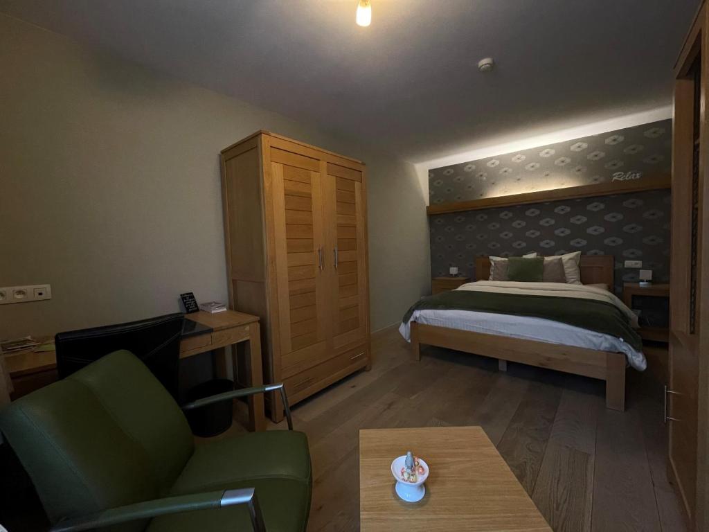 Postel nebo postele na pokoji v ubytování B&B Het KoeKoeKsnest Schelle