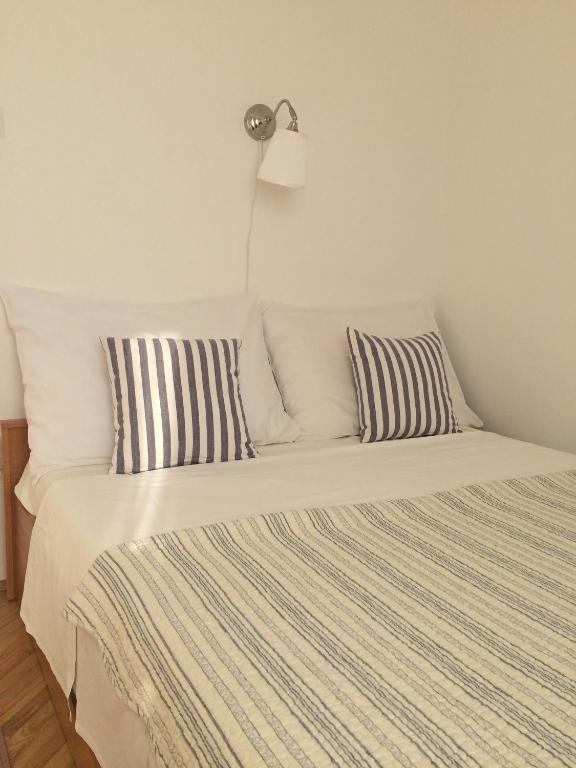 Postel nebo postele na pokoji v ubytování Apartments & Room Paula