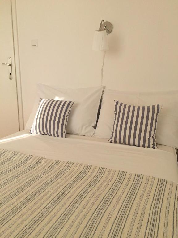 Postel nebo postele na pokoji v ubytování Apartments & Room Paula