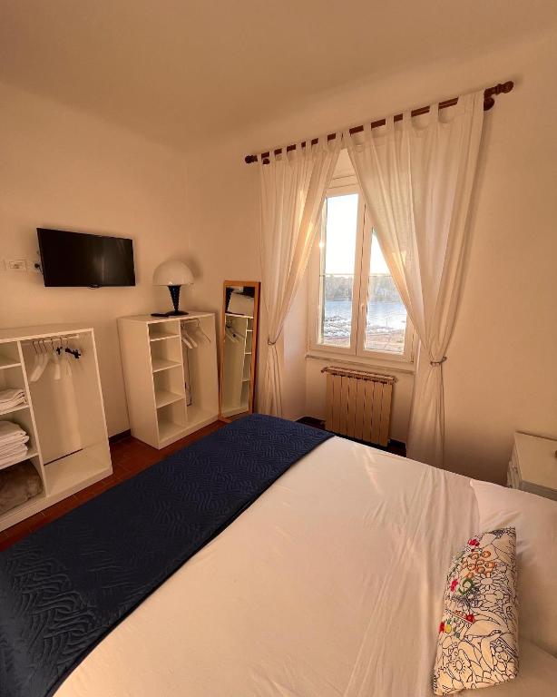 Postel nebo postele na pokoji v ubytování Casa Le Grazie