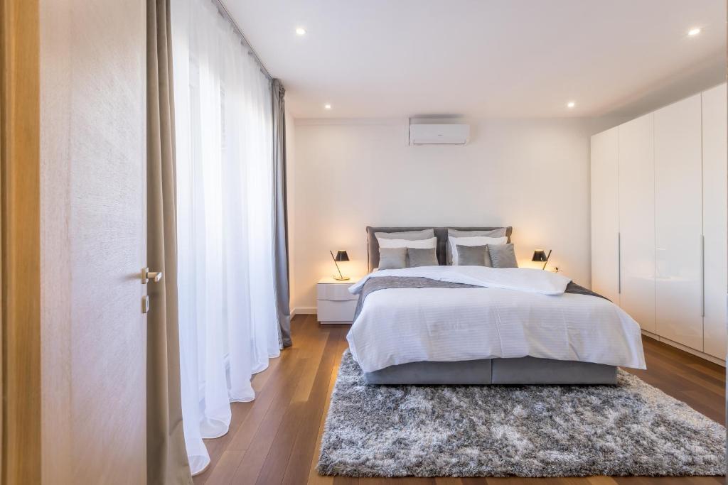 Postel nebo postele na pokoji v ubytování Apartment FORTUNA