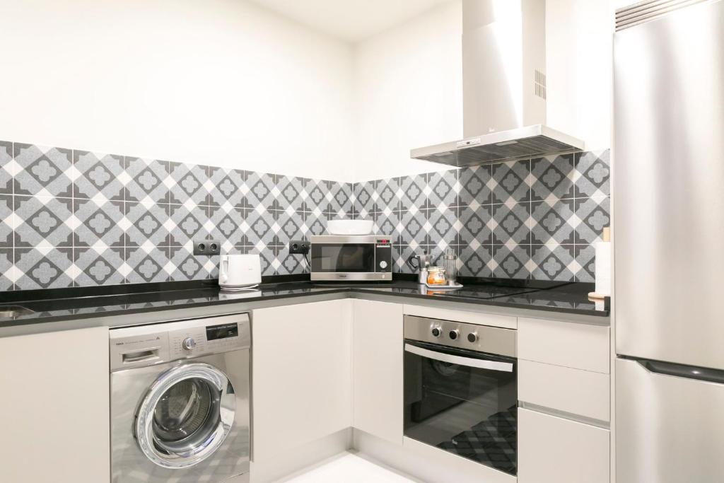 Kuchyňa alebo kuchynka v ubytovaní Aqua Apartments Málaga