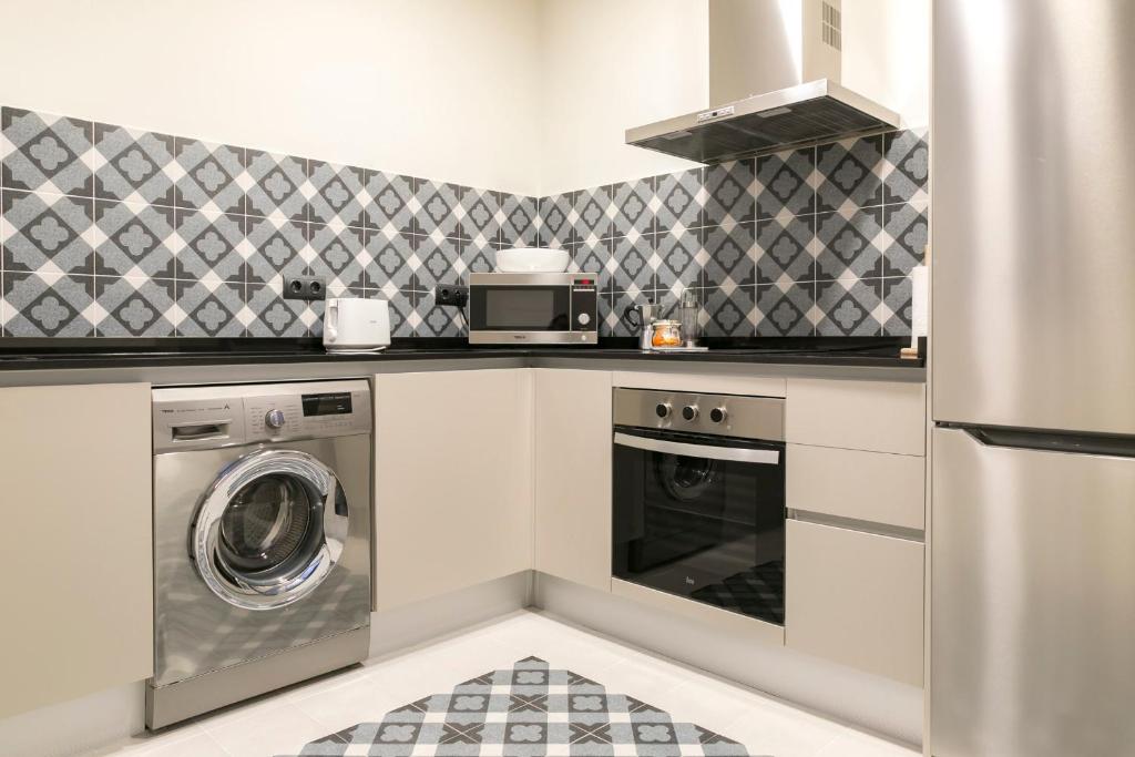 Kuchyňa alebo kuchynka v ubytovaní Aqua Apartments Málaga