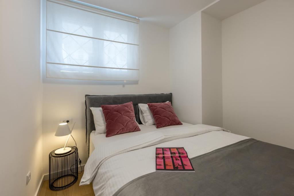 Postel nebo postele na pokoji v ubytování Apartment FORTUNA