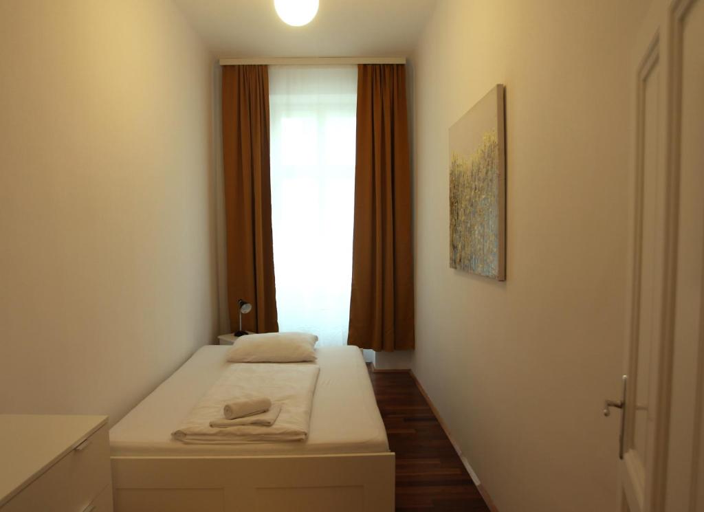 Posteľ alebo postele v izbe v ubytovaní Casa Nostra - Ausgefallene Wohnung am Augarten