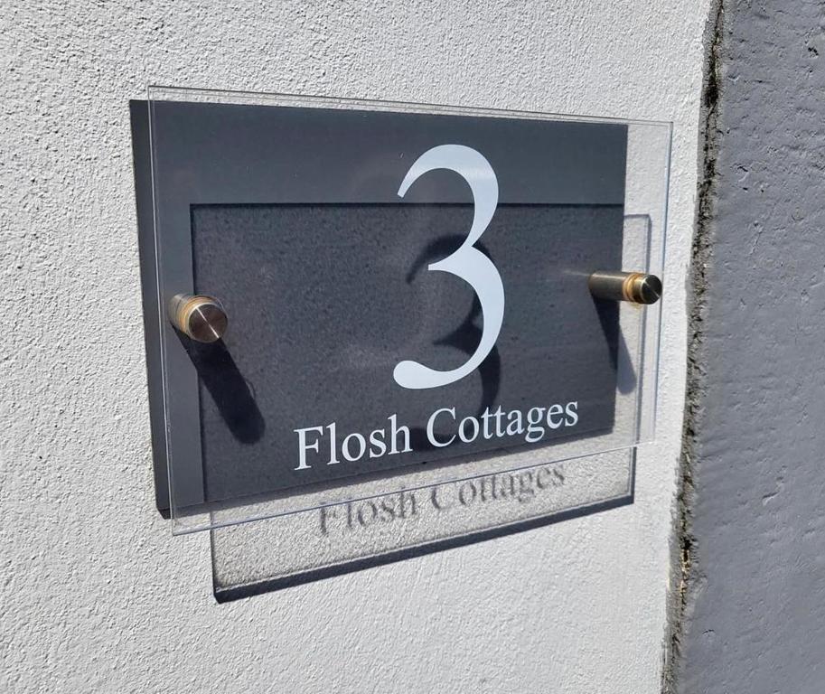 a sign for the fish colleges on a wall at Flosh Cottage Lake District in Cleator