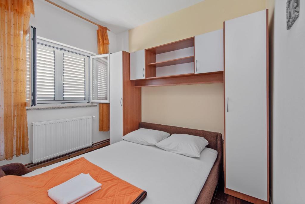 Postel nebo postele na pokoji v ubytování Aparthotel Vila Danica