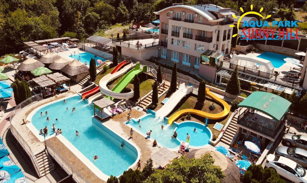 an aerial view of a swimming pool at a resort at Sunny Hill Apartments & Aqua Park in Vrnjačka Banja