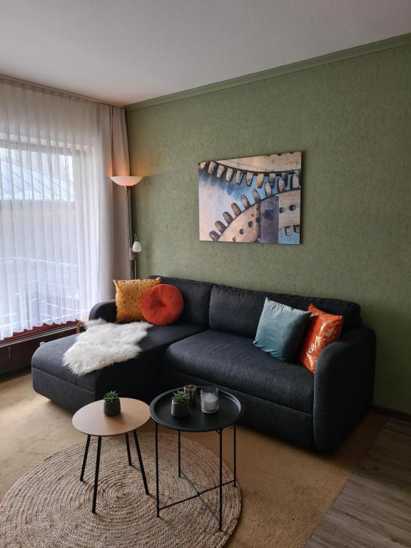a living room with a couch and two tables at Dagmar's vakantieappartement in Winterberg in Winterberg