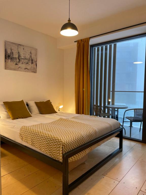 Postel nebo postele na pokoji v ubytování New Gudauri Atrium 211