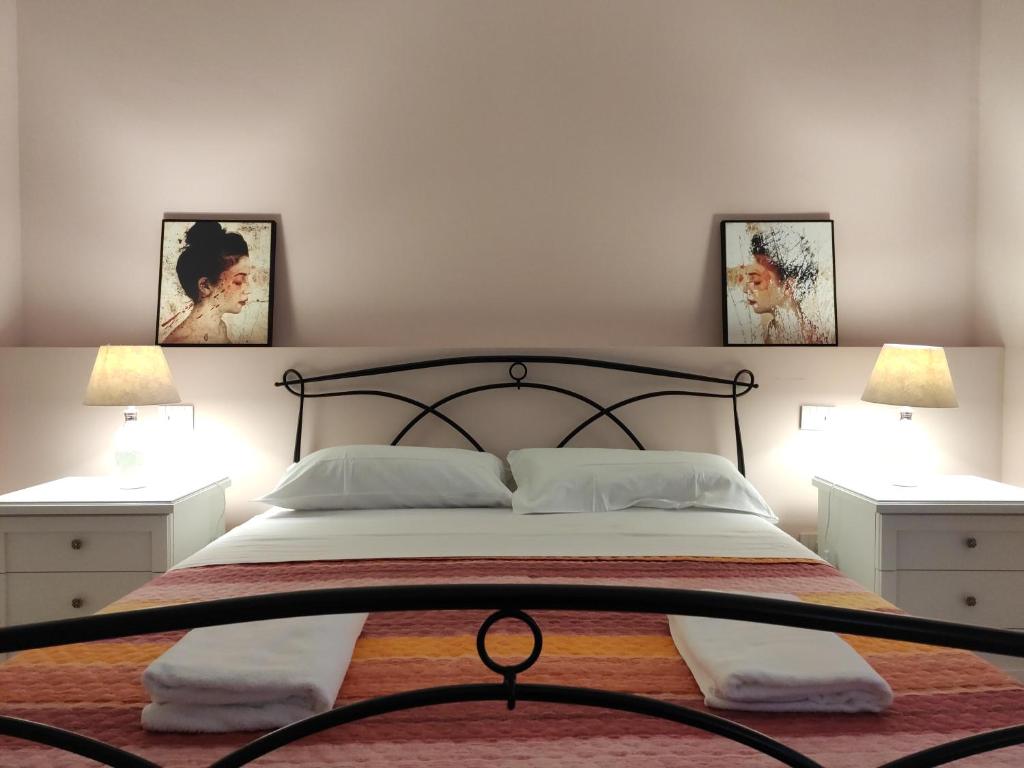 Postel nebo postele na pokoji v ubytování GArt Riviera B&B