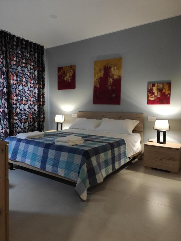 Postel nebo postele na pokoji v ubytování GArt Riviera B&B