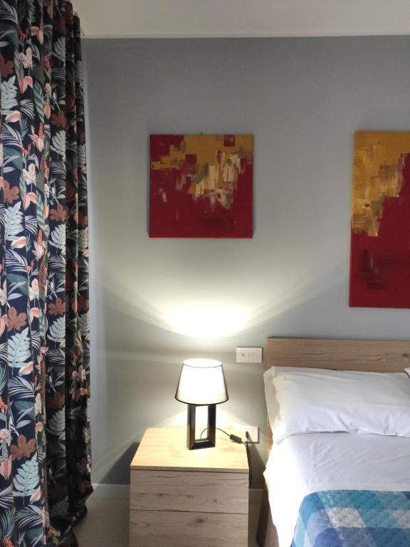 Postel nebo postele na pokoji v ubytování GArt Riviera B&B