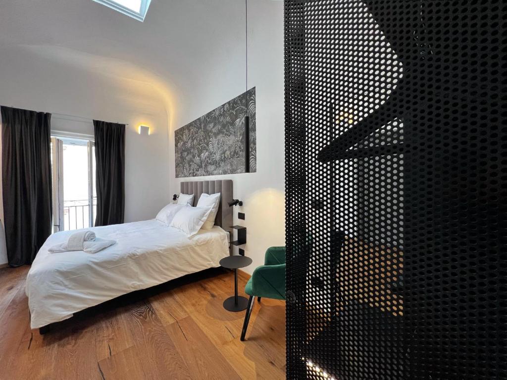 Postel nebo postele na pokoji v ubytování Gioiamia - Luxury Rooms in Cattedrale