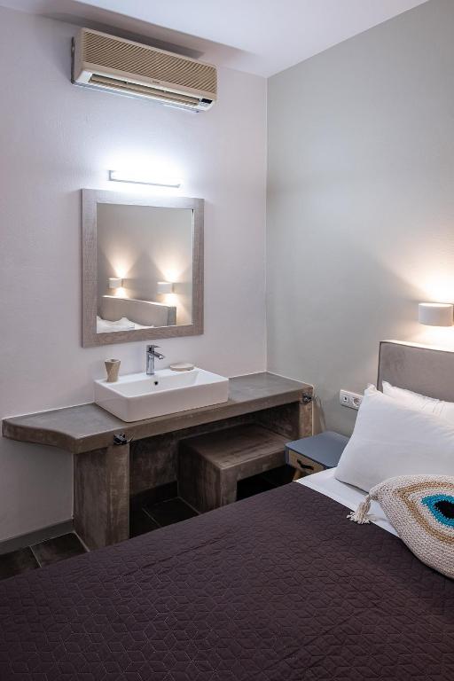Postel nebo postele na pokoji v ubytování Dilion Hotel