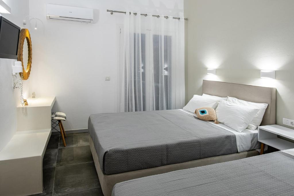 Postel nebo postele na pokoji v ubytování Dilion Hotel