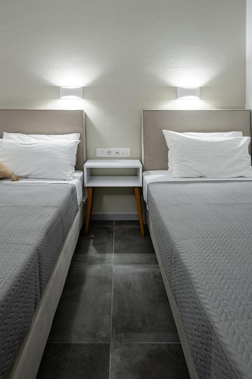 Postel nebo postele na pokoji v ubytování Dilion Hotel