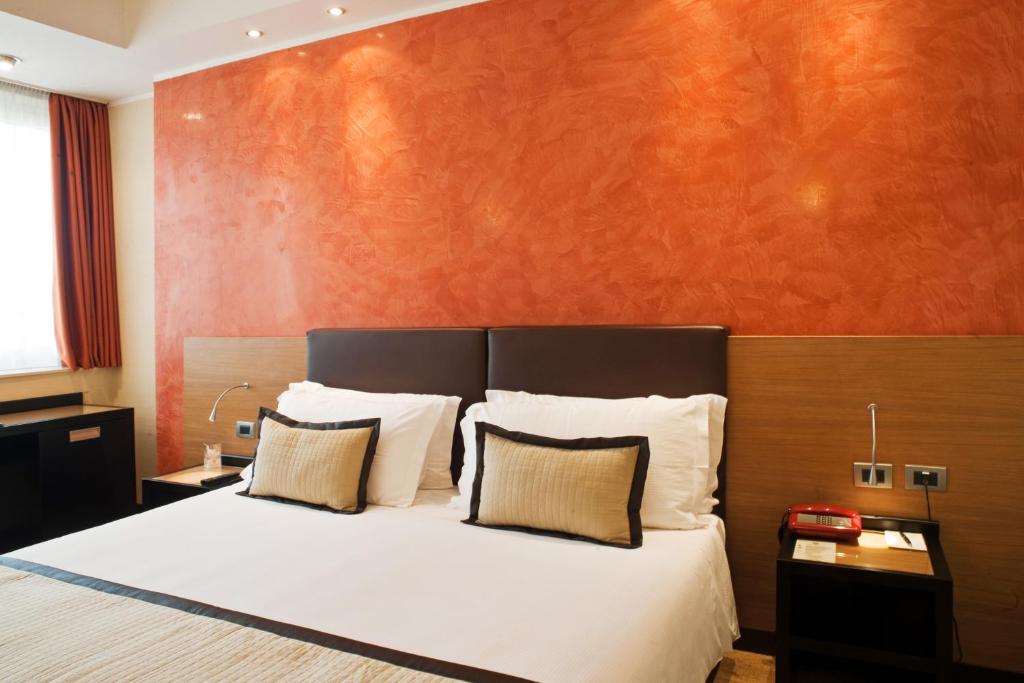 Postel nebo postele na pokoji v ubytování Hotel San Pietro