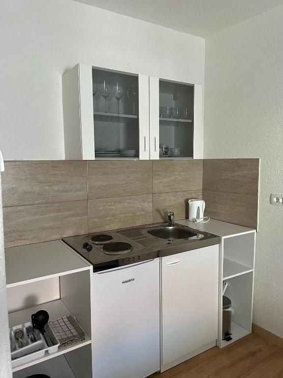 Kuchyň nebo kuchyňský kout v ubytování Apartments Graz