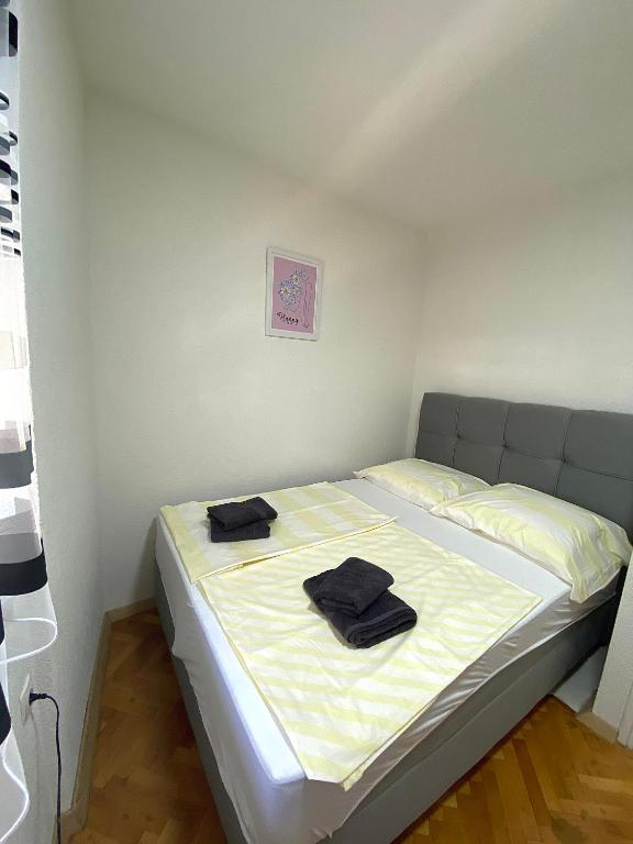 Postel nebo postele na pokoji v ubytování Apartments Graz