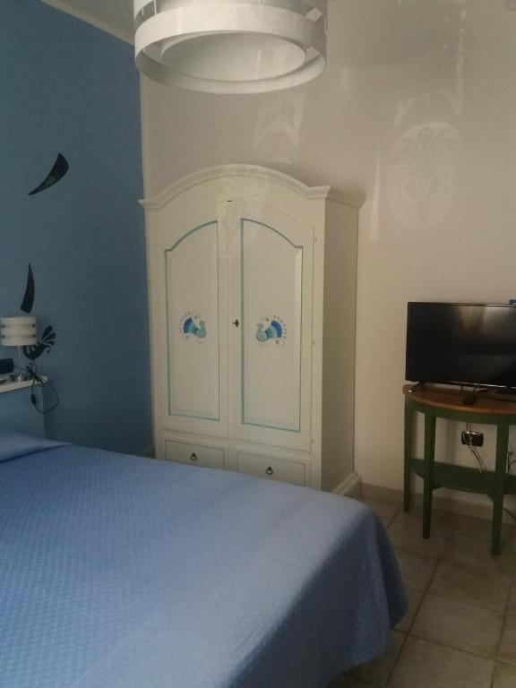 Postel nebo postele na pokoji v ubytování I Due Ciuchini Sardinia