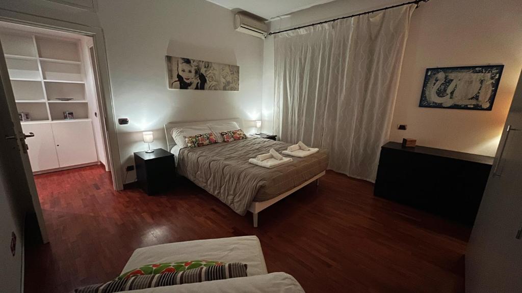 A bed or beds in a room at FG St Peter's Suites