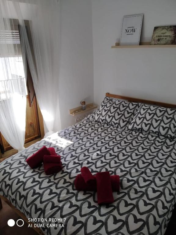 Łóżko lub łóżka w pokoju w obiekcie La Casita de Guille