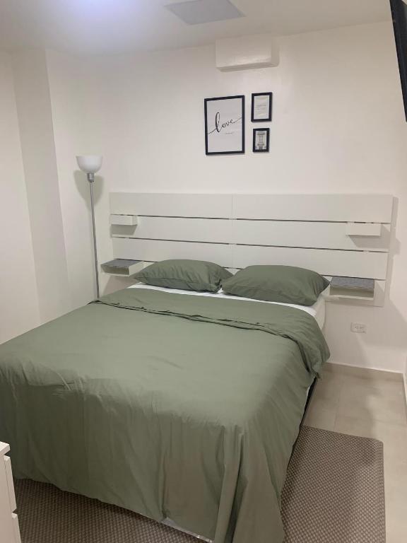Postel nebo postele na pokoji v ubytování Hotel Conquistador Santo Domingo
