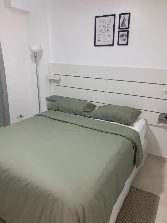 Postel nebo postele na pokoji v ubytování Hotel Conquistador Santo Domingo