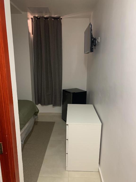 Postel nebo postele na pokoji v ubytování Hotel Conquistador Santo Domingo
