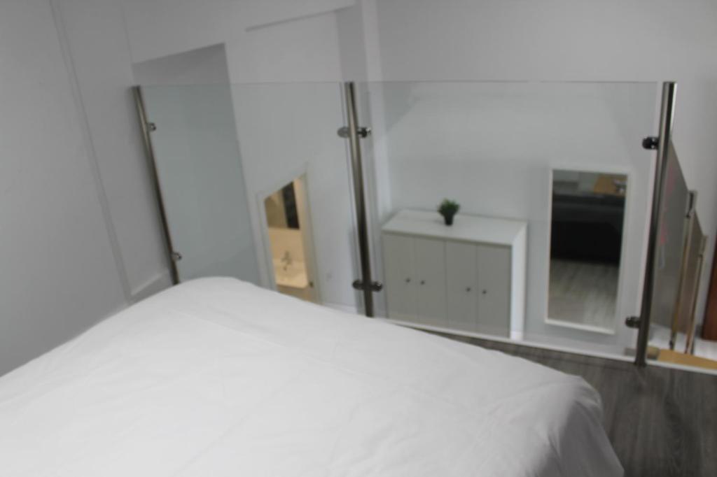 Posteľ alebo postele v izbe v ubytovaní Apartamentos los Nidillos