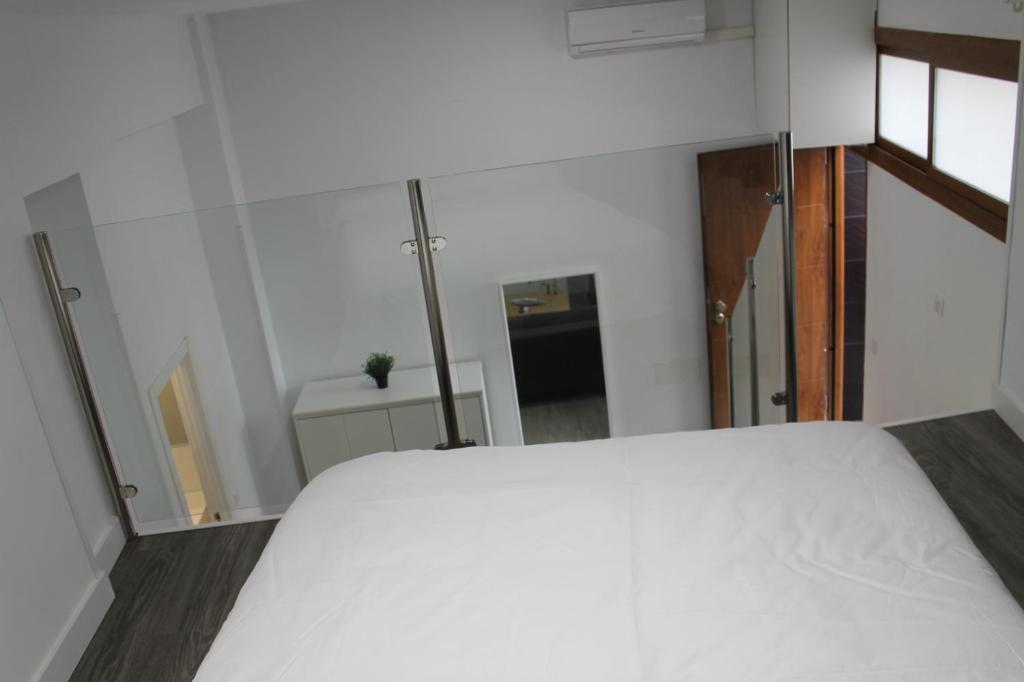 Posteľ alebo postele v izbe v ubytovaní Apartamentos los Nidillos
