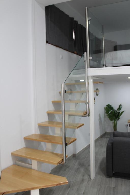 Televízia a/alebo spoločenská miestnosť v ubytovaní Apartamentos los Nidillos