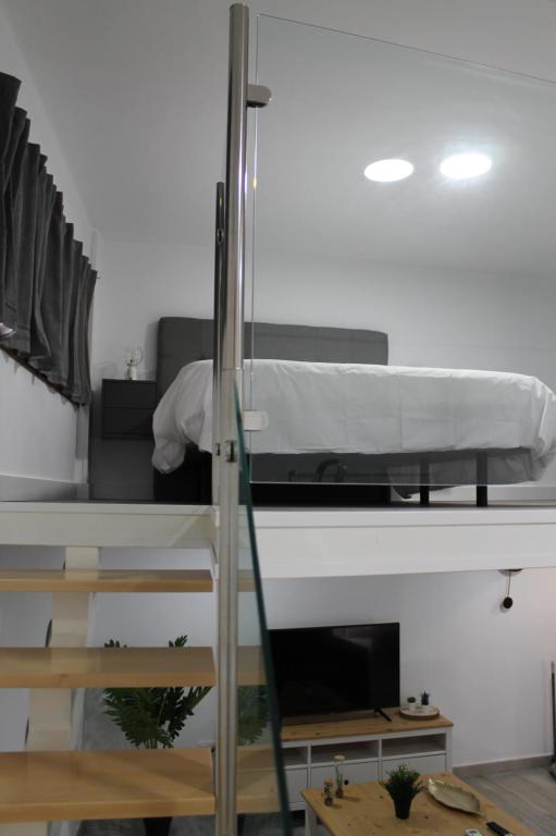 Posteľ alebo postele v izbe v ubytovaní Apartamentos los Nidillos