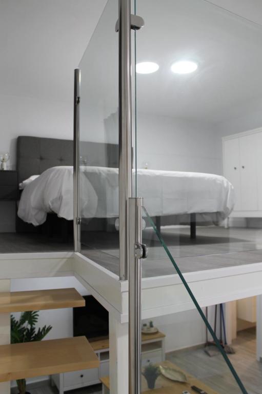Posteľ alebo postele v izbe v ubytovaní Apartamentos los Nidillos