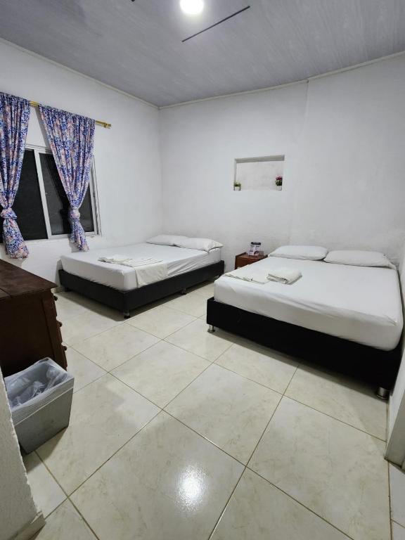 Postel nebo postele na pokoji v ubytování Eco Hotel El Reposo