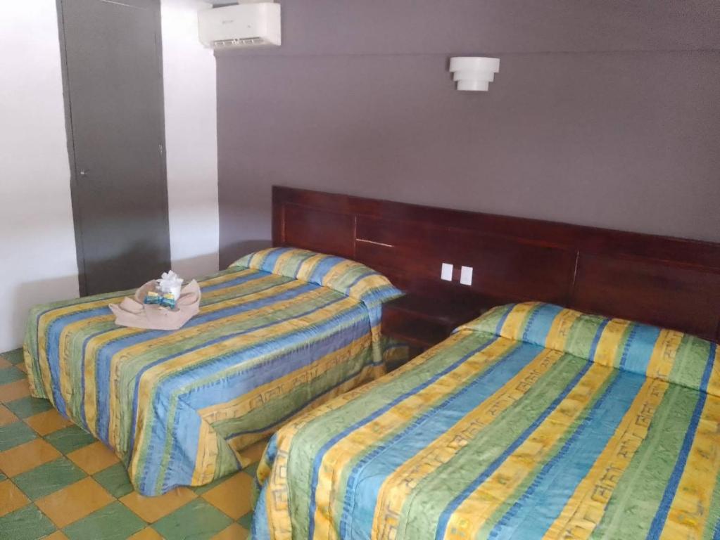 Postel nebo postele na pokoji v ubytování Hotel Verasol