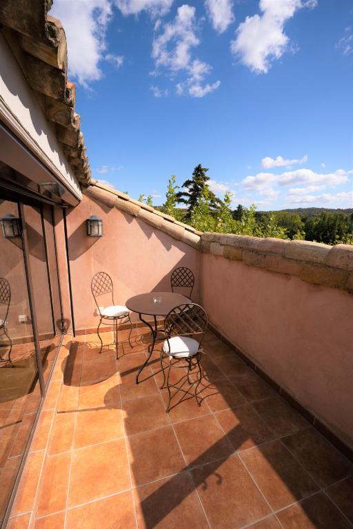 Balkón nebo terasa v ubytování Hôtel Le Mas des Grès & Restaurant Sous les Platanes