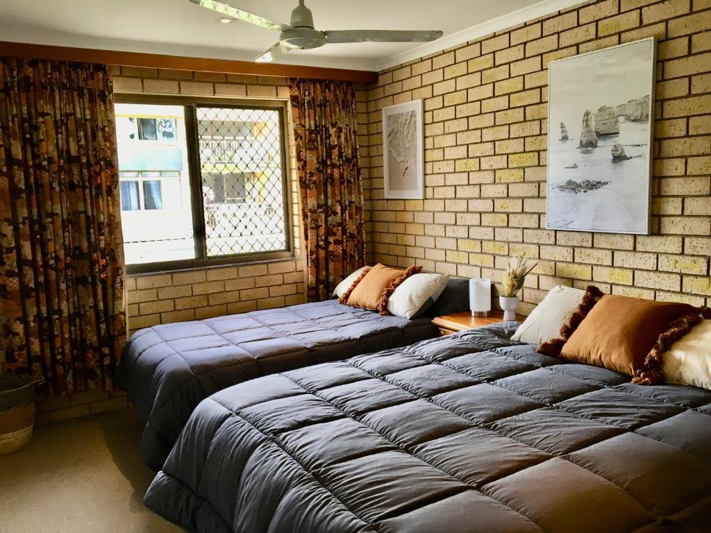 Postel nebo postele na pokoji v ubytování SeascapeatAlexBeach Budget Accomodation