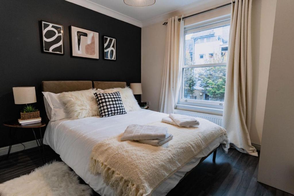 Postelja oz. postelje v sobi nastanitve 5-bedroom Haven, Perfect For Business And Leisure