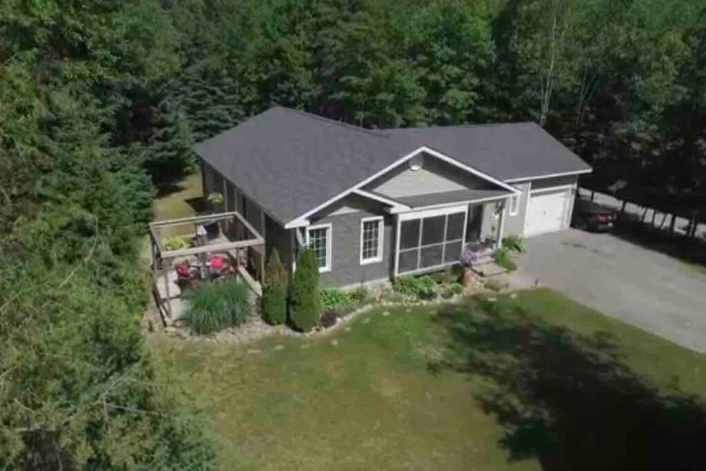 an aerial view of a house at Modern 4 season cottage retreat in Huntsville