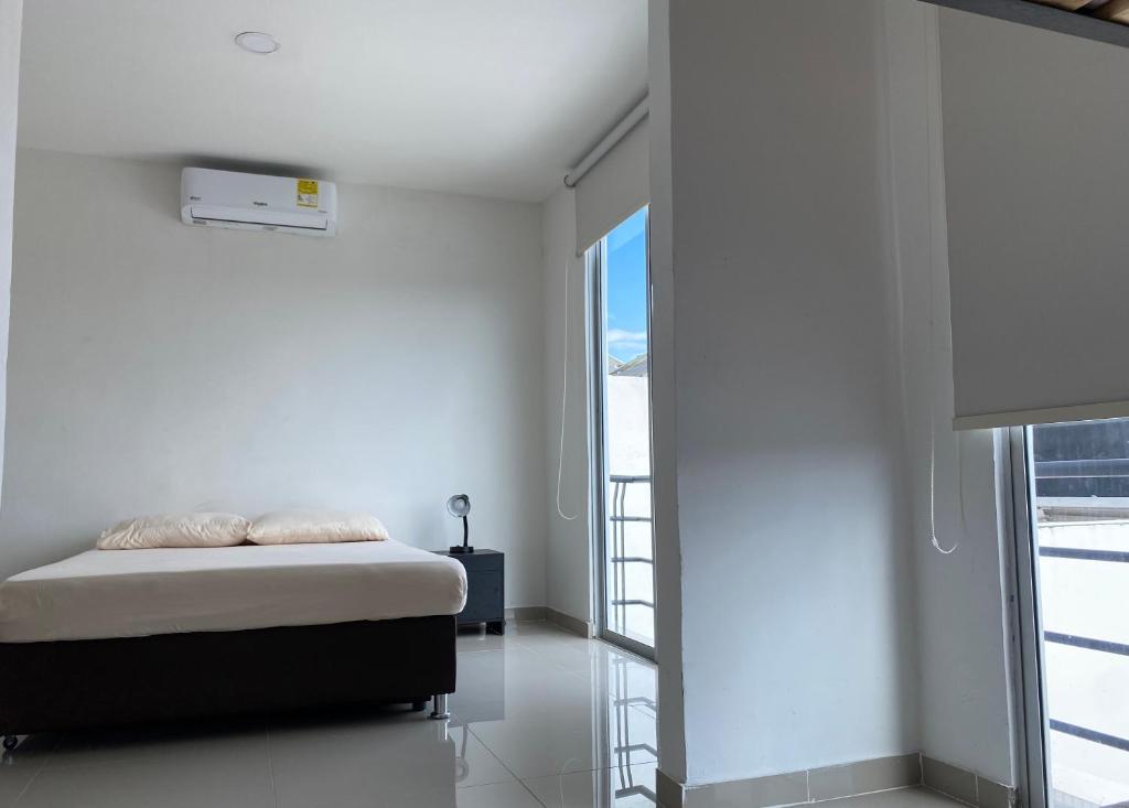 Postel nebo postele na pokoji v ubytování CASA VIA EL PEÑON