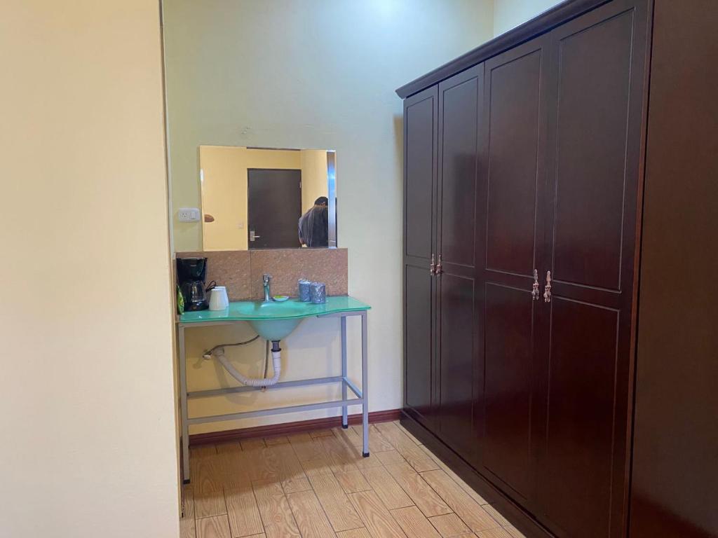 Kuchyň nebo kuchyňský kout v ubytování Villa Garita Inn