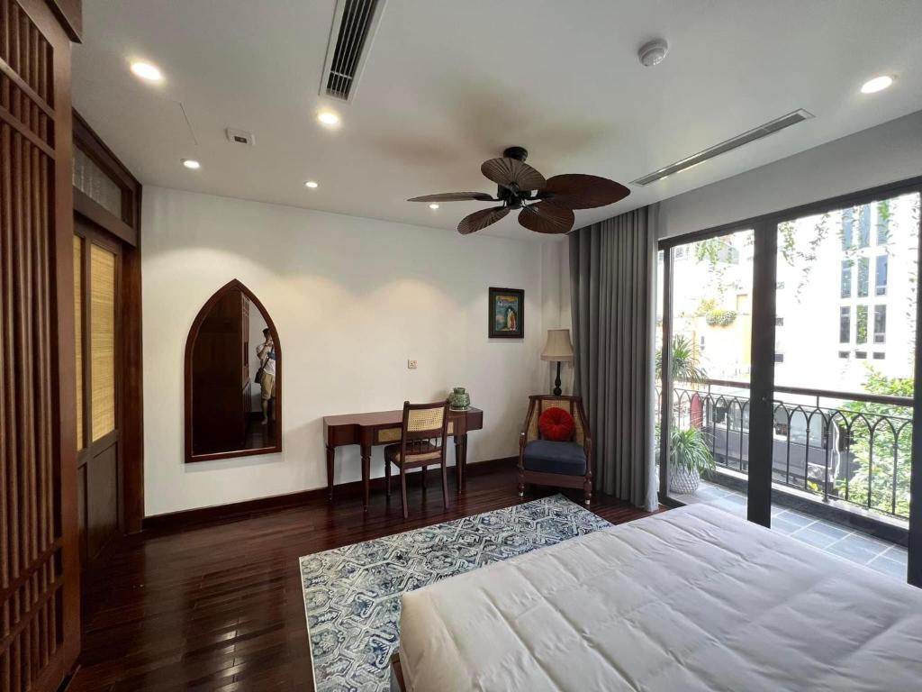 Postel nebo postele na pokoji v ubytování Camellia Residence Hanoi