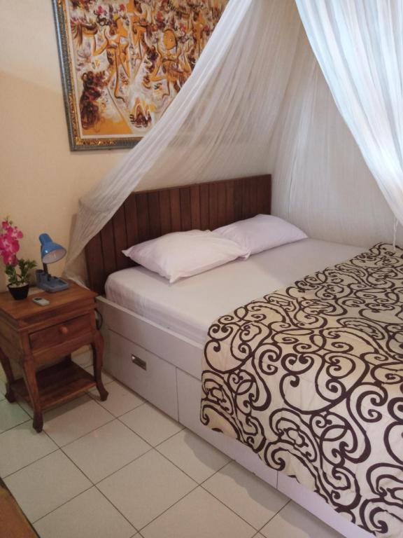 Postel nebo postele na pokoji v ubytování Damuh Guest House