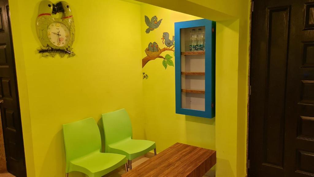Posezení v ubytování Godwill Kimo Guest house Seraulim