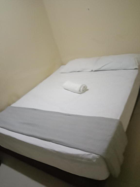 Postel nebo postele na pokoji v ubytování RAS Hotel