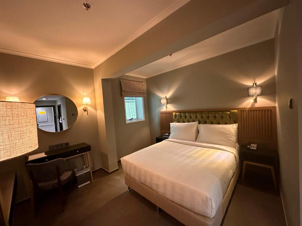 Postel nebo postele na pokoji v ubytování President Hotel