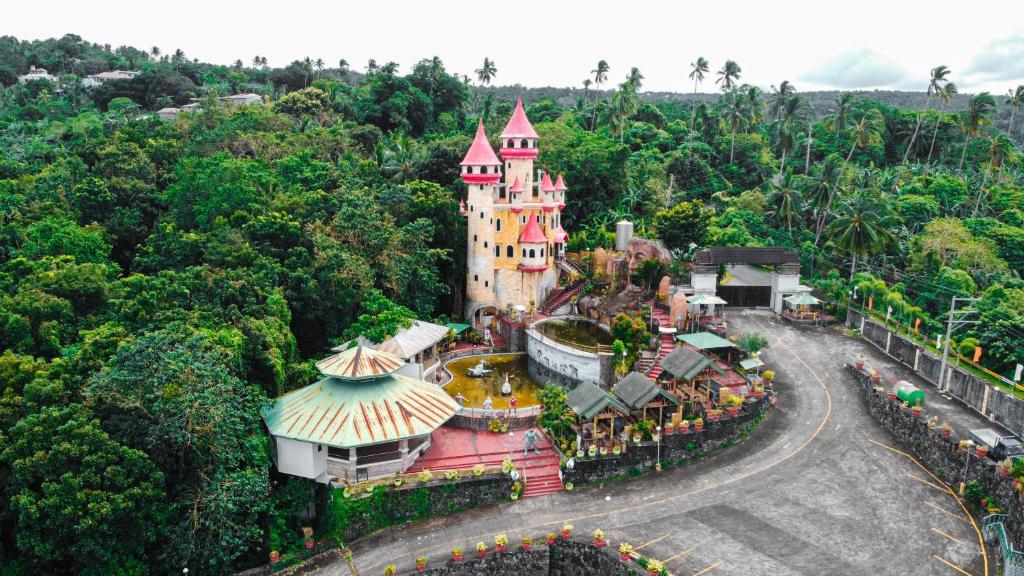 an aerial view of the disney castle at La Virginia Leisure Park and Amusement powered by Cocotel in Mataasnakahoy